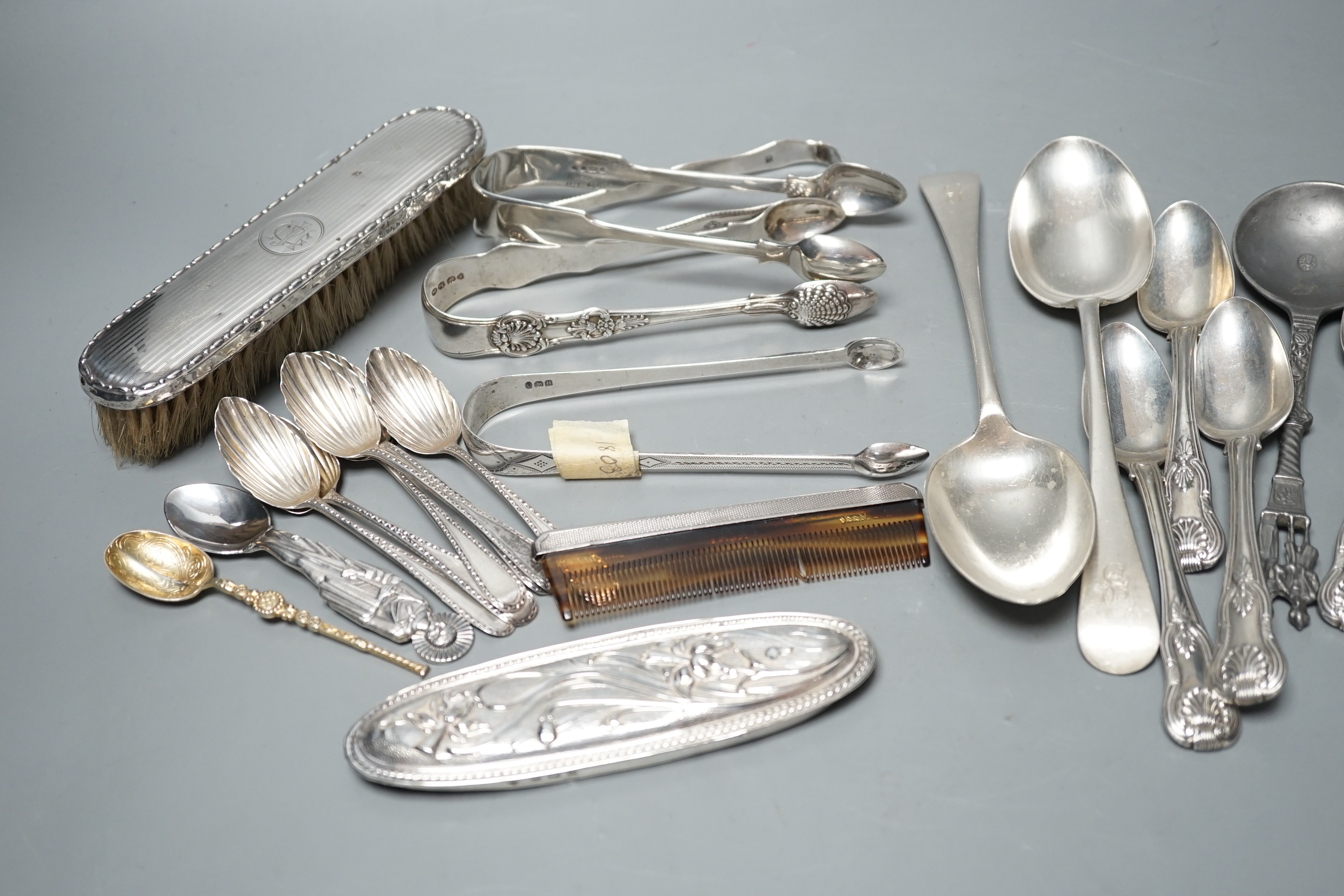 A small quantity of assorted silver flatware including a set of six teaspoons, by Peter, Ann & William Bateman, London, 1800, a pair of Victorian tablespoons, three pairs of silver sugar tongs etc. and a pewter spoon and